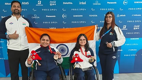 Indian shooters Avani Lekhara and Mona Agarwal celebrate with their coaches after winning medals in the Women’s 10m Air Rifle Standing SH1 event at the Paris Paralympics 2024.